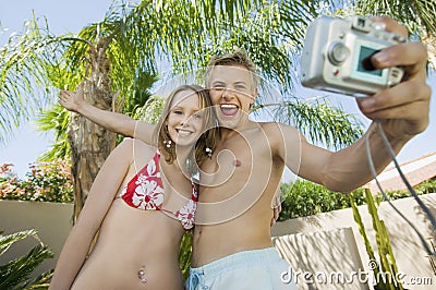 Young couple taking photo of themselves