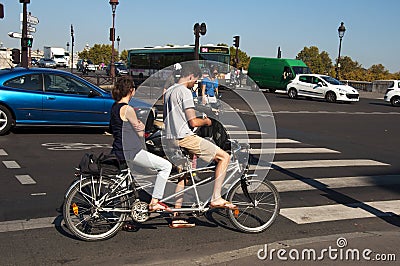 Young couple on a tandem bike
