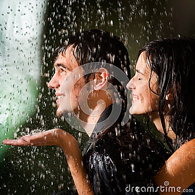 Young couple under a rain