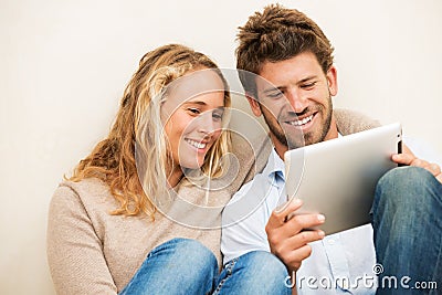 Young couple using tablet computer