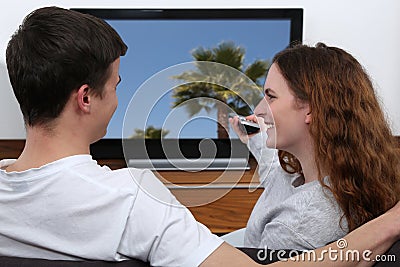 Young couple watching tv