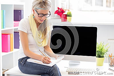 Young creative woman working in the office