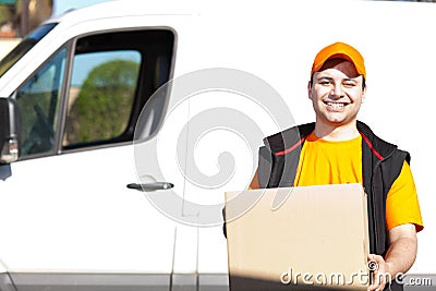 Young delivery man portrait at work