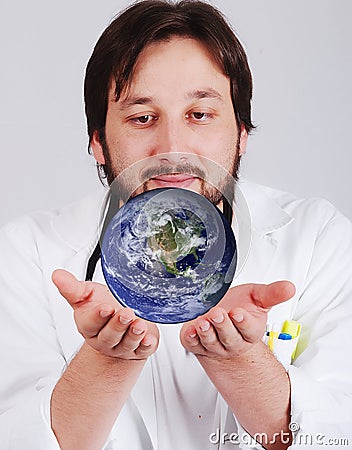 Young doctor with beard is holding earth in hands