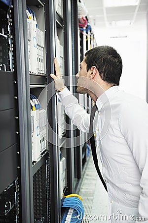 Young it engeneer in datacenter server room