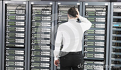 Young it engeneer in datacenter server room