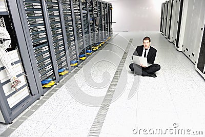 Young it engeneer in datacenter server room