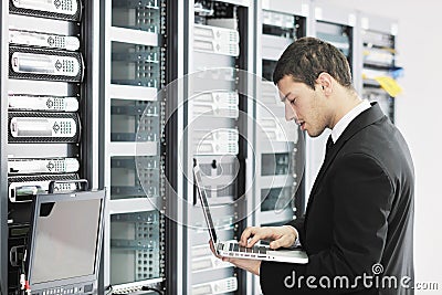 Young it engeneer in datacenter server room