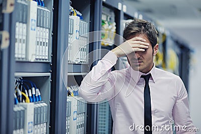 Young it engeneer in datacenter server room