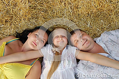 A young family, father, mother and daughter