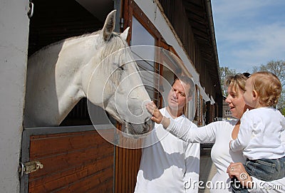 Young family and horse