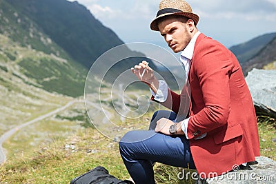 Young fashion man with cigarette outdoor