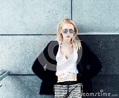 Young fashionable blonde girl posing.
