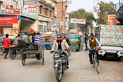 Young fashioned indian man rides the retro motocycle