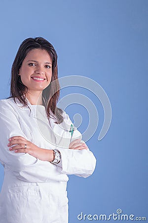 Young female doctor portrait with blue backgound