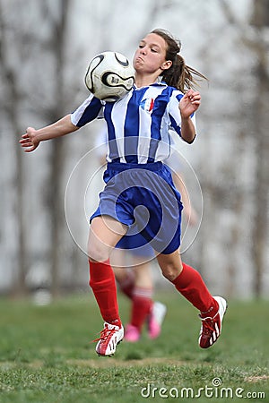 Young female soccer player – chest stop