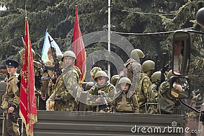 Young fighters of the militarized column of military equipment o