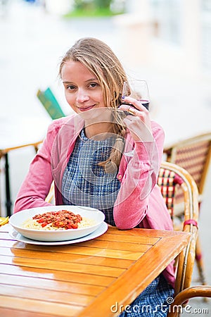 Young French woman having lunch