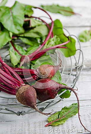 Young, fresh organic beets with green leaves