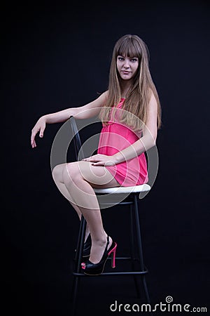 Young girl on a bar stool