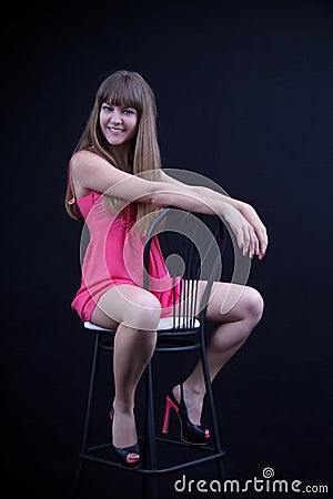 Young girl on a bar stool