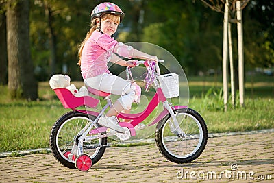 Young girl on bike, active child concept