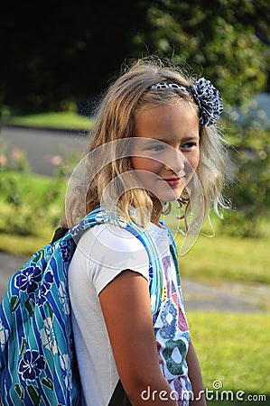 Young girl on the first day of school
