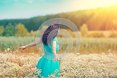 Young girl on the flower field