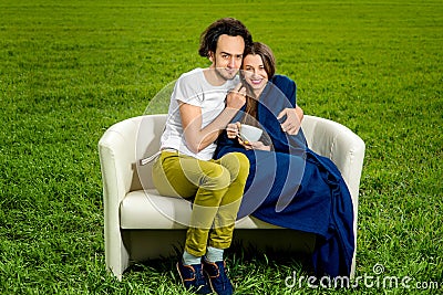 Young girl listening to the music and resting on the couch