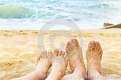Young girl and man legs in sea