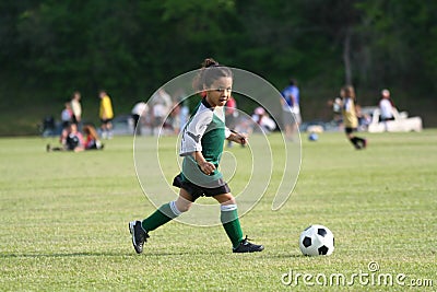 Young Girl Playing Soccer