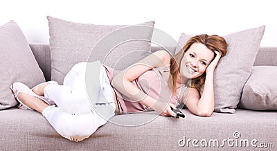 Young girl relaxing and watching TV