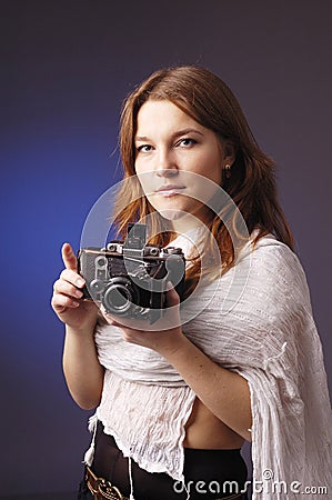 Young girl with retro camera