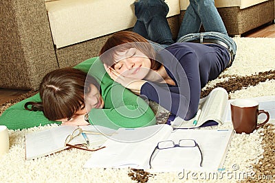 Young girl students are tired to study and sleep