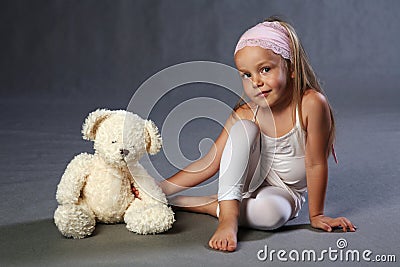 Young girl and teddy bear