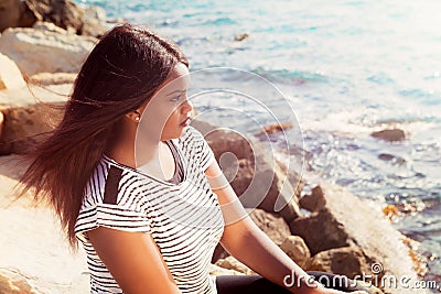 Young Girl Thinking By The Sea