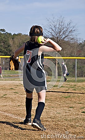 Young Girl Throwing Softball