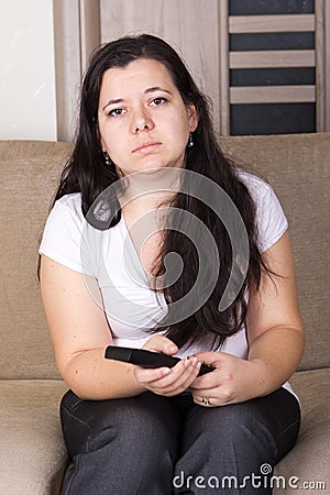 Young girl watching TV at home