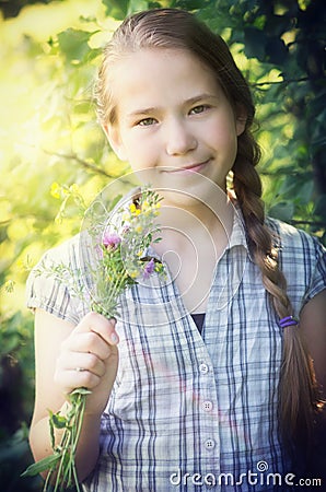 Young girl with wild flowers