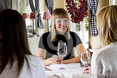 Young Girls Having Dinner In Fancy Restaurant