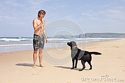 Young guy playing with his dog