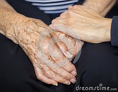 Young hand consoling old hands