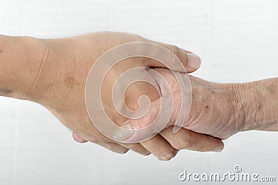 Young hand give help to old hand