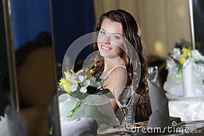 Young happy beautiful woman in restaurant