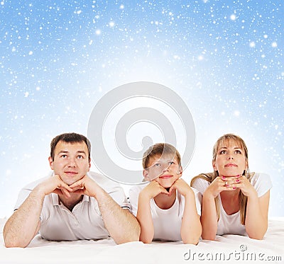 A young and happy family on a blue background