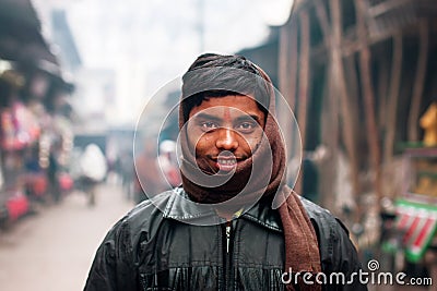 Young Indian man wrapped in a scarf