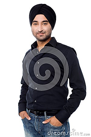 Young isolated Indian guy posing casually