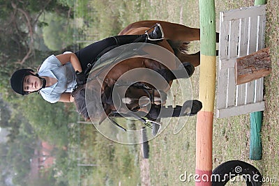 Young Lady on Pony jumping