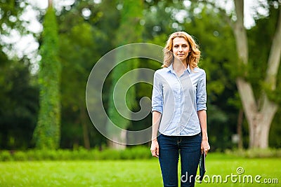 Young lady with tablet in park