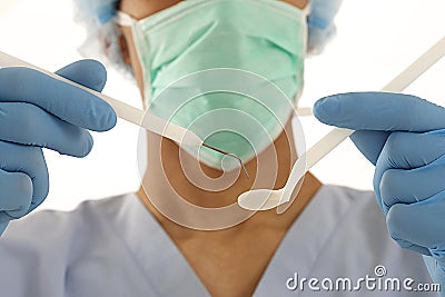 Young male dentist with tools